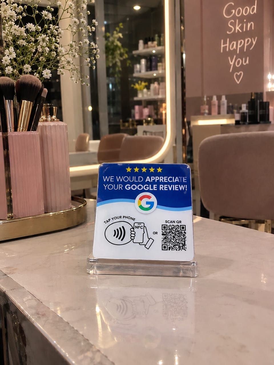 Google review card displayed at a beauty salon counter